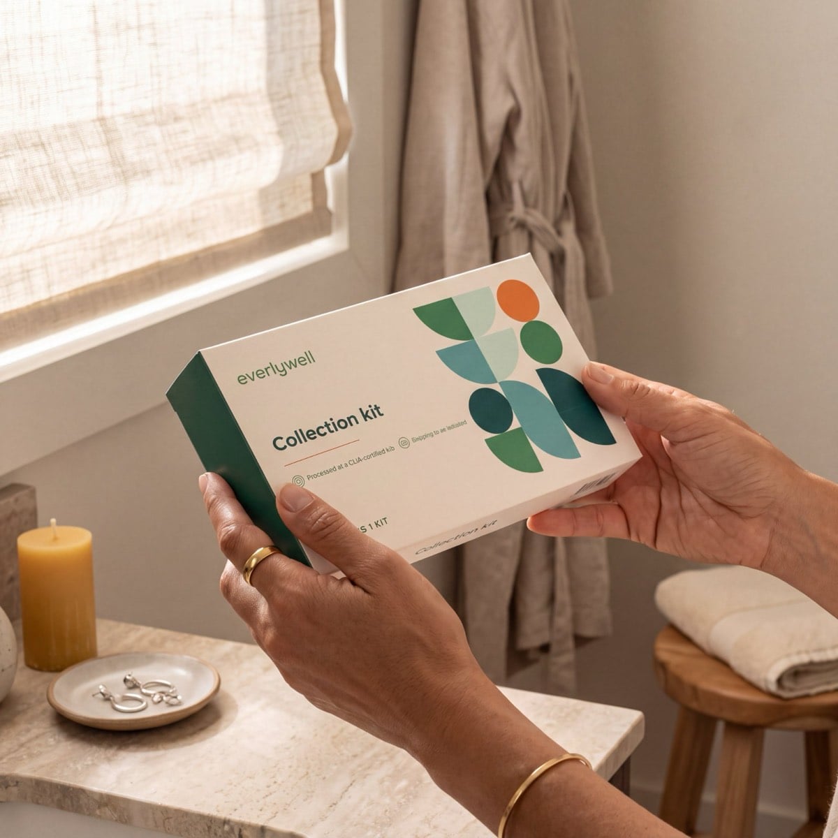 The Women's Health Test kit in hand at home